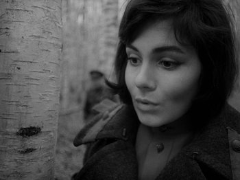 Movie still from “Ivan's Childhood” (1962), directed by Eduard Abalov – A black - and - white photo of a woman looking at the camera; Close Up shot, High angle