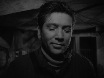 Movie still from “Ivan's Childhood” (1962), directed by Eduard Abalov – Black and white photograph of a man with his eyes closed; Close Up shot, Low angle
