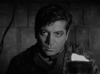 Movie still from “Ivan's Childhood” (1962), directed by Eduard Abalov – Black and white photograph of a man in a military uniform; Close Up shot, Over the shoulder angle