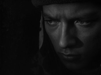 Movie still from “Ivan's Childhood” (1962), directed by Eduard Abalov – A person looking at the camera; Close Up shot, High angle