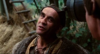 Movie still from “Jabberwocky” (1977), directed by Terry Gilliam – A person wearing a hat; Close Up shot, Low angle