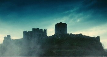 Movie still from “Jabberwocky” (1977), directed by Terry Gilliam – A castle on top of a hill in the middle of the night; Extreme Wide shot, Low angle