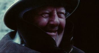 Movie still from “Jabberwocky” (1977), directed by Terry Gilliam – A person wearing a hat; Extreme Close Up shot, Low angle