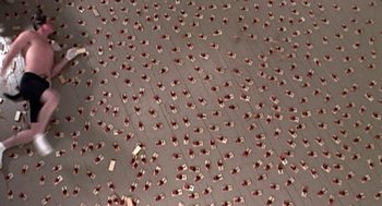 Movie still from “Jackass: The Movie” (2002), directed by Jeff Tremaine – A room filled with lots and lots of red cups on the floor; Extreme Wide shot, Overhead angle