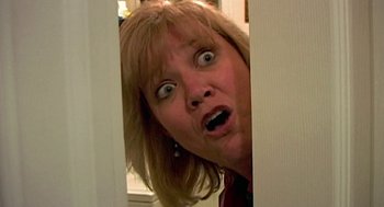 Movie still from “Jackass: The Movie” (2002), directed by Jeff Tremaine – A person with her mouth wide open; Close Up shot, Low angle