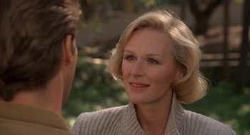 Movie still from “Jagged Edge” (1985), directed by Richard Marquand – An older woman talking to a younger man outside; Close Up shot, Over the shoulder angle