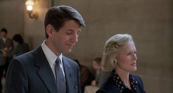 Movie still from “Jagged Edge” (1985), directed by Richard Marquand – A man and a woman standing next to each other; Close Up shot, Low angle