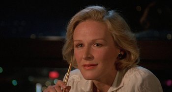 Movie still from “Jagged Edge” (1985), directed by Richard Marquand – A person holding a pen; Close Up shot, Low angle