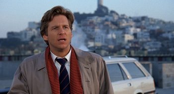 Movie still from “Jagged Edge” (1985), directed by Richard Marquand – A man wearing a jacket and a tie; Close Up shot, Low angle