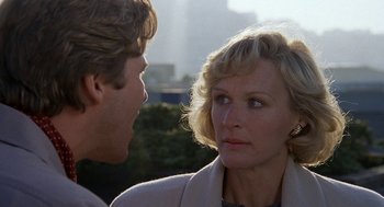 Movie still from “Jagged Edge” (1985), directed by Richard Marquand – A man and a woman talking to each other; Close Up shot, Over the shoulder angle