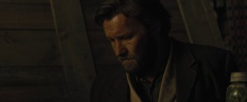 Movie still from “Jane Got a Gun” (2015), directed by Gavin O'Connor – A person with a beard; Close Up shot, Over the shoulder angle