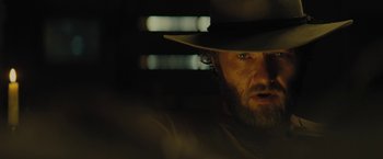 Movie still from “Jane Got a Gun” (2015), directed by Gavin O'Connor – A person wearing a cowboy hat; Close Up shot, Low angle