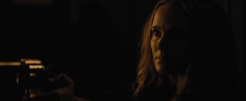 Movie still from “Jane Got a Gun” (2015), directed by Gavin O'Connor – A person holding a cell phone; Close Up shot, Over the shoulder angle