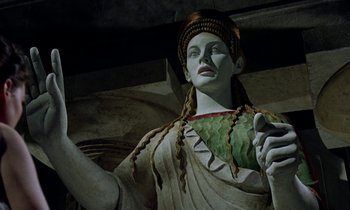 Movie still from “Jason and the Argonauts” (1963), directed by Don Chaffey – A statue of a woman holding a leaf; Close Up shot, Low angle