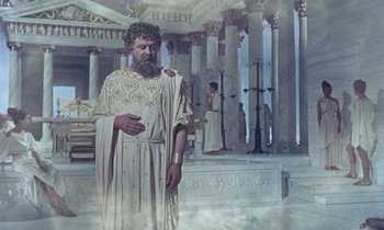 Movie still from “Jason and the Argonauts” (1963), directed by Don Chaffey – A painting of a man in a white robe; Wide shot, High angle