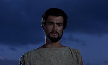 Movie still from “Jason and the Argonauts” (1963), directed by Don Chaffey – A man with a beard is standing in front of the sky; Close Up shot, Low angle
