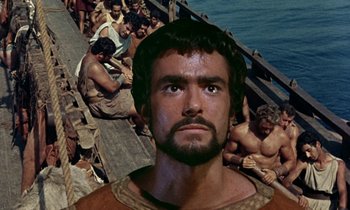 Movie still from “Jason and the Argonauts” (1963), directed by Don Chaffey – A man with a beard is standing in front of a group of people; Close Up shot, Low angle