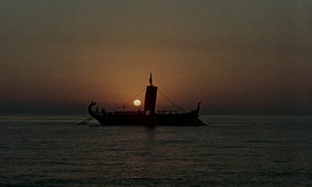 Movie still from “Jason and the Argonauts” (1963), directed by Don Chaffey – A boat sailing in the ocean at sunset; Extreme Wide shot, Low angle