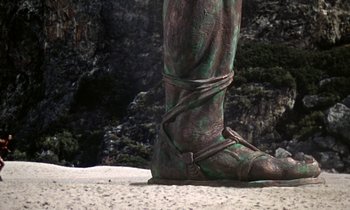 Movie still from “Jason and the Argonauts” (1963), directed by Don Chaffey – View of a statue of a person's foot; Wide shot, Low angle