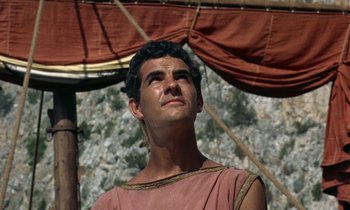 Movie still from “Jason and the Argonauts” (1963), directed by Don Chaffey – A man wearing a toga stands in front of mountains; Close Up shot, Low angle