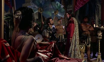 Movie still from “Jason and the Argonauts” (1963), directed by Don Chaffey – A group of people dressed in ancient roman clothing; Medium shot, Over the shoulder angle