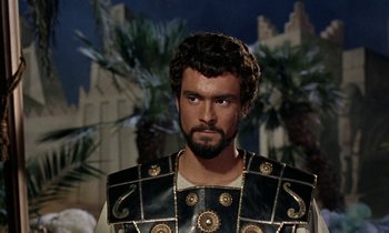 Movie still from “Jason and the Argonauts” (1963), directed by Don Chaffey – A person wearing a suit of armor; Close Up shot, Over the shoulder angle