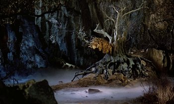Movie still from “Jason and the Argonauts” (1963), directed by Don Chaffey – An image of an animal that is sitting in the dirt; Wide shot, Low angle