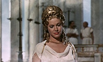 Movie still from “Jason and the Argonauts” (1963), directed by Don Chaffey – A woman in a white dress and a gold head piece; Close Up shot, Low angle