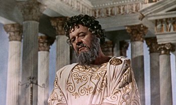 Movie still from “Jason and the Argonauts” (1963), directed by Don Chaffey – An old man with a beard and a wig in an ancient greek setting; Medium shot, Low angle
