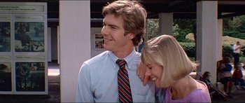 Movie still from “Jaws 3-D” (1983), directed by Joe Alves – A man and a woman smiling for the camera; Close Up shot, Low angle