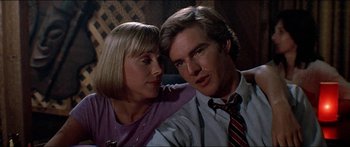 Movie still from “Jaws 3-D” (1983), directed by Joe Alves – A man and a woman sitting next to each other; Close Up shot, Low angle