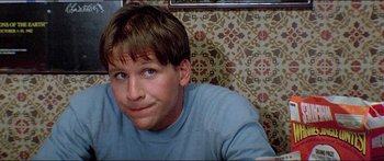 Movie still from “Jaws 3-D” (1983), directed by Joe Alves – A person sitting in a room; Close Up shot, Low angle