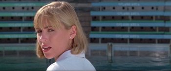 Movie still from “Jaws 3-D” (1983), directed by Joe Alves – A woman with blonde hair wearing a white shirt; Close Up shot, Low angle