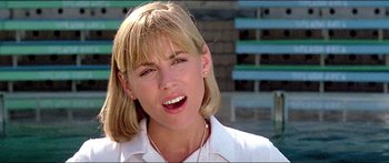 Movie still from “Jaws 3-D” (1983), directed by Joe Alves – A person with blonde hair wearing a white shirt; Close Up shot, Low angle