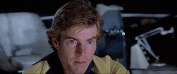 Movie still from “Jaws 3-D” (1983), directed by Joe Alves – A man's face as he stares into the distance; Close Up shot, Low angle