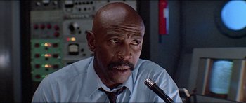 Movie still from “Jaws 3-D” (1983), directed by Joe Alves – An older man with a beard and a tie; Close Up shot, Low angle