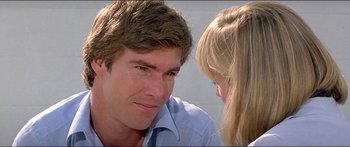 Movie still from “Jaws 3-D” (1983), directed by Joe Alves – A man and a woman sitting next to each other; Close Up shot, Over the shoulder angle