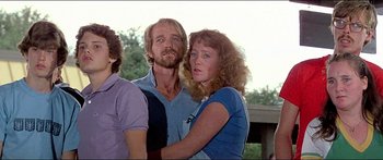 Movie still from “Jaws 3-D” (1983), directed by Joe Alves – A man and a woman standing next to each other; Medium shot, Low angle