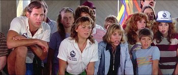 Movie still from “Jaws 3-D” (1983), directed by Joe Alves – A group of people that are standing in a room; Close Up shot, Low angle