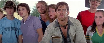 Movie still from “Jaws 3-D” (1983), directed by Joe Alves – A group of people standing next to each other; Close Up shot, Low angle