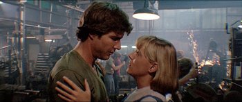 Movie still from “Jaws 3-D” (1983), directed by Joe Alves – A man and a woman standing next to each other; Close Up shot, Low angle