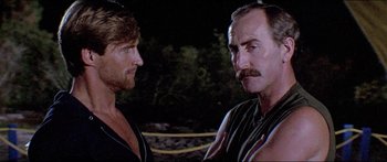 Movie still from “Jaws 3-D” (1983), directed by Joe Alves – Two men are standing next to each other in the dark; Close Up shot, Low angle