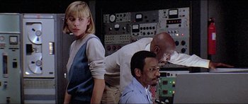 Movie still from “Jaws 3-D” (1983), directed by Joe Alves – A group of people standing next to each other in a room; Medium shot, Low angle