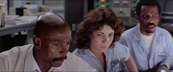 Movie still from “Jaws 3-D” (1983), directed by Joe Alves – A man and a woman sitting next to each other; Close Up shot, Low angle