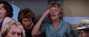 Movie still from “Jaws 3-D” (1983), directed by Joe Alves – Two older women looking at each other with one of them holding her hand up to her eye; Close Up shot, Low angle