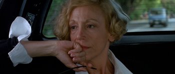 Movie still from “Jaws: The Revenge” (1987), directed by Joseph Sargent – A person sitting in a car; Close Up shot, Low angle