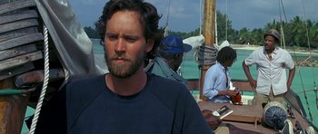 Movie still from “Jaws: The Revenge” (1987), directed by Joseph Sargent – A person on a boat; Medium shot, Over the shoulder angle