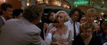 Movie still from “Jaws: The Revenge” (1987), directed by Joseph Sargent – A man feeding a woman a piece of cake; Close Up shot, Over the shoulder angle