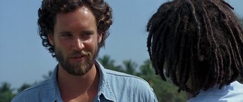 Movie still from “Jaws: The Revenge” (1987), directed by Joseph Sargent – A person with a beard; Close Up shot, Over the shoulder angle