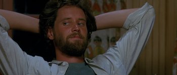 Movie still from “Jaws: The Revenge” (1987), directed by Joseph Sargent – A person with a beard; Close Up shot, Low angle